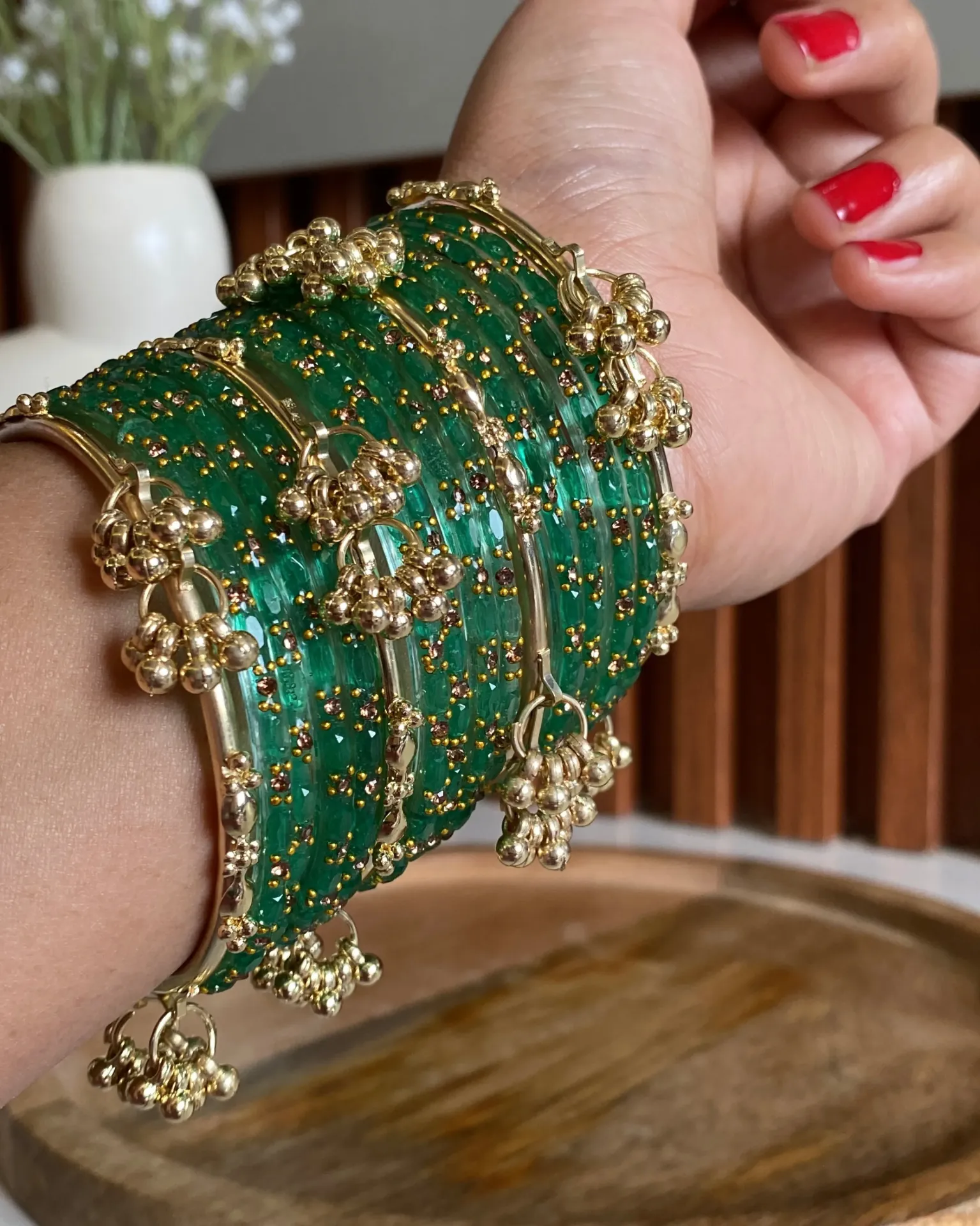Vibrant Emerald Green Glass Bangle Set with Golden Ghoonghroo Accents – 16-Piece